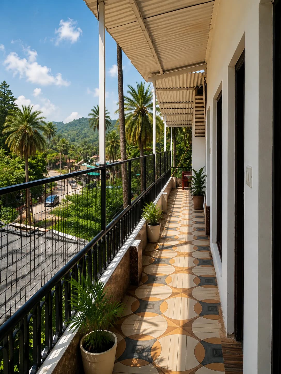 A tiled balcony at The Plum overlooking the hills
